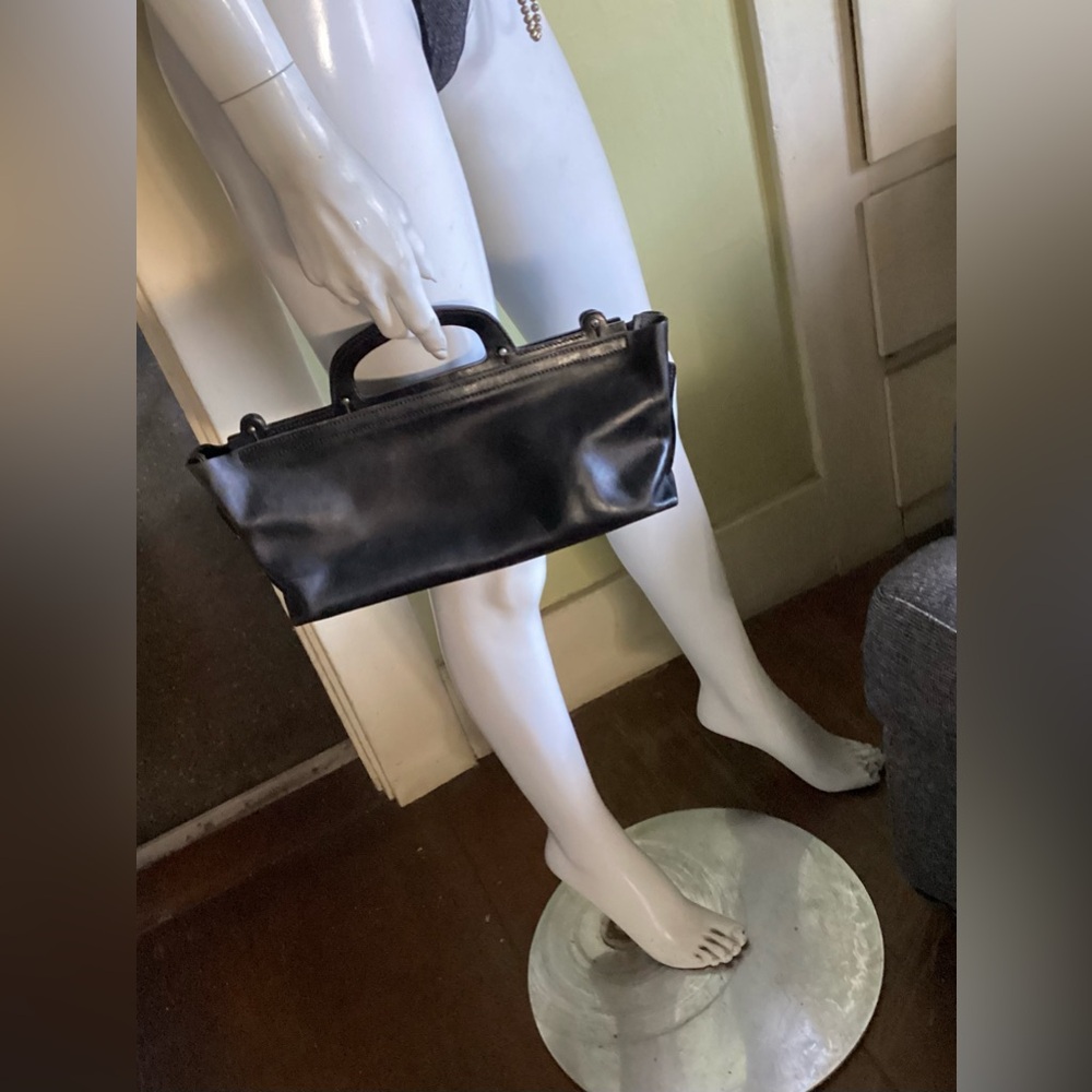 ISSAC REINA sleek minimalist leather bag made in France